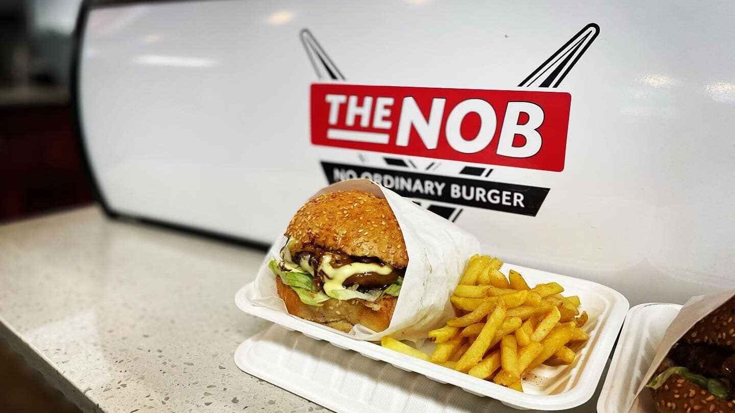 No Ordinary Burger Food and Logo