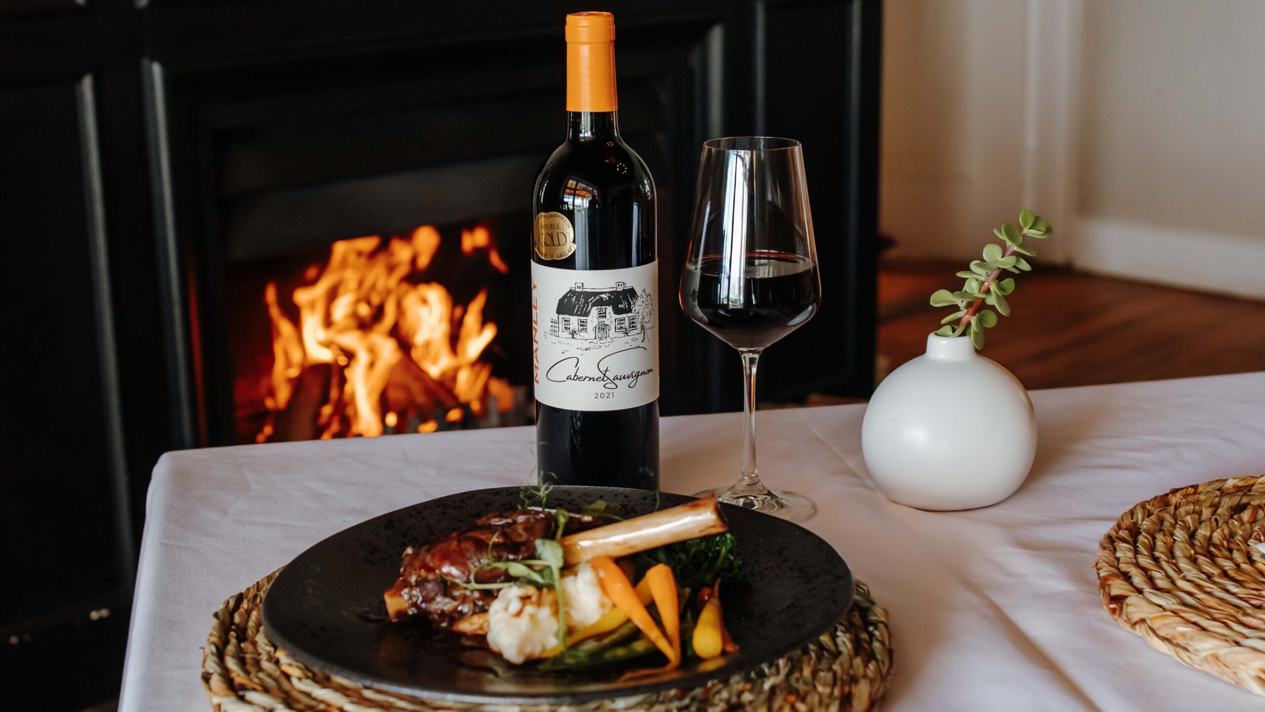 Manley wine and a fireplace