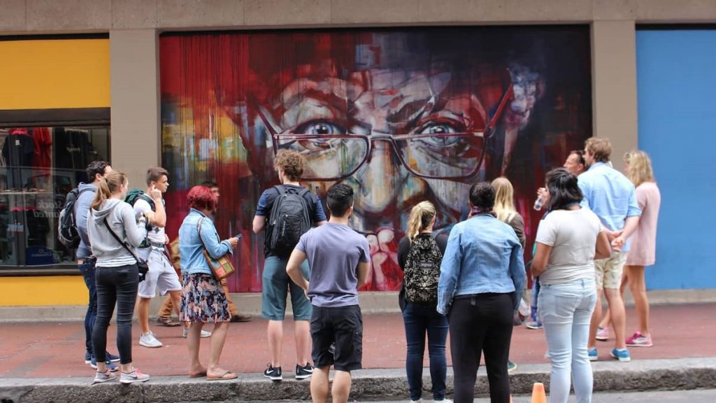 Cape Town historical tour group looking at mural