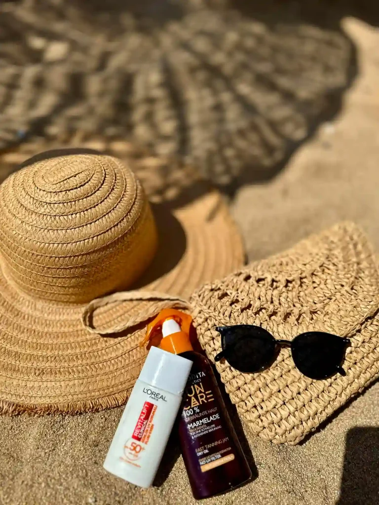 Hat, Sunscreen, and Sunglasses - Camps Bay Beach Cape Town
