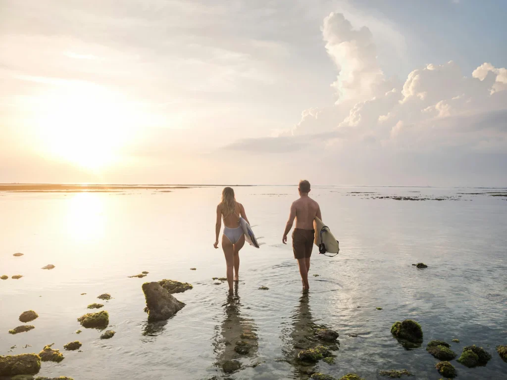Two People Walking with Surfboards - 2 Day Cape Town Itinerary